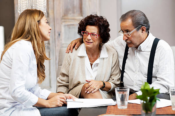 istock Senior couple meeting with financial advisor. 143919947