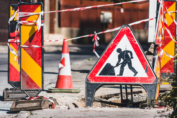 istock Road construction in progress with traffic signs 1439200346