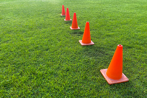 Orange cones on football fields for sport practice concerts