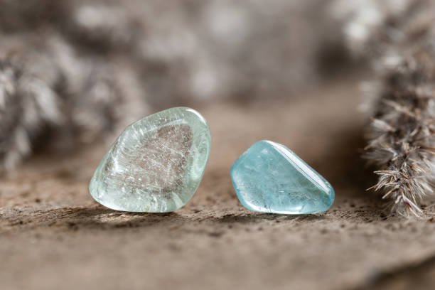 istock Two Samples of Blue Topaz Mineral Stones on Wood 1439200392