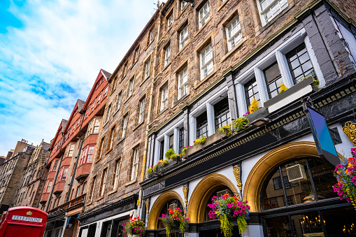 Edinburgh The Royal Mile capital city of Scotland UK United Kingdom. Several streets considered as the main thoroughfare of the Old Town. On mile long, is the busiest tourist street in the Old Town. Runs from Edinburgh Castle to Holyrood Palace