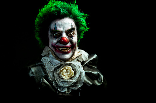 A stock photo of a creepy evil vampire clown against a dark textured background.
[url=http://www.istockphoto.com/search/lightbox/10593020#1071a130][IMG]http://www.bellaorastudios.com/banners/new01.jpg[/IMG][/url]