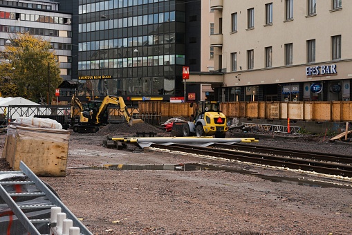 Helsinki, Finland – October 12, 2019: Construction of a tramline and road resurfacing outside of the Sörnäinen metro station