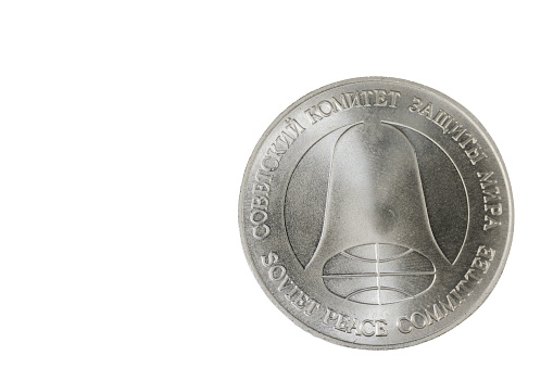 Close up view of back side  disarmament coins made of metal of (SS-4) Soviet medium range missiles scrapped under Soviet-American INF Treaty.