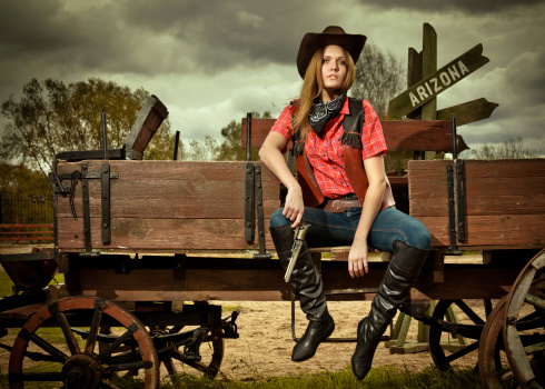 An attractive young cowgirl standing in the stables http://195.154.178.81/DATA/i_collage/pi/shoots/783508.jpg