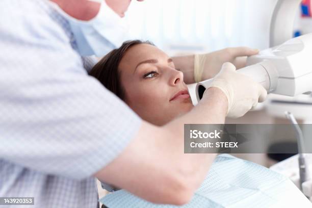 Female Patient Going Through Dental Treatment Stock Photo - Download Image Now - Dentist, X-ray Image, Patient