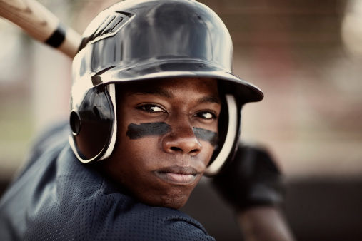 Close up of an African American baseball player who is ready to mash the ball.