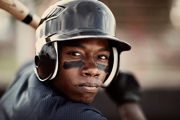 Baseball Player Close up of an African American baseball player who is ready to mash the ball. batting sports activity photos stock pictures, royalty-free photos & images