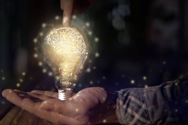 istock light bulb in hand and brain icon Concept creative idea and innovation 1439205228