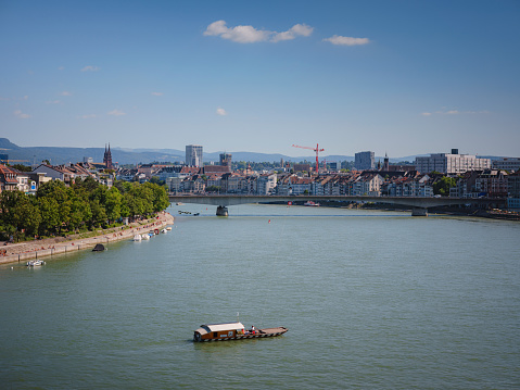 BASEL, SWITZERLAND, JULY 7, 2022: ferryboat crossing the river Rhine