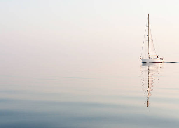 istock sailing alone at a beautiful foggy sea 143920691