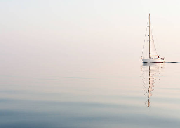 sailing alone at a beautiful foggy sea  jib stock pictures, royalty-free photos & images