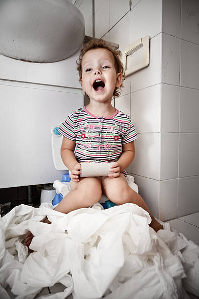 End of toilet paper Little girl with a roll of toilet paper potty toilet child bathroom stock pictures, royalty-free photos & images