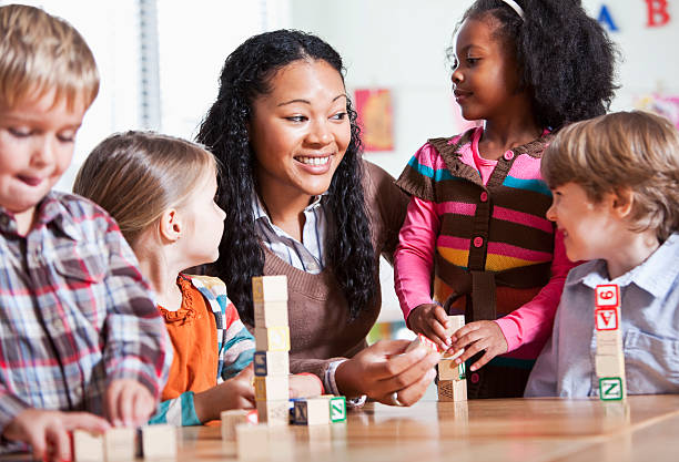 istock Preschool children in classroom with teacher 143920732