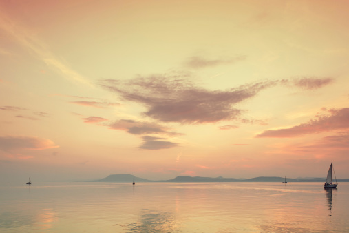 sailboat on the lake at sunset. Location: Lake Balaton, Hungary