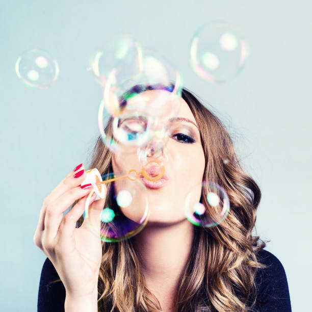istock Woman Blow Bubbles 143920812