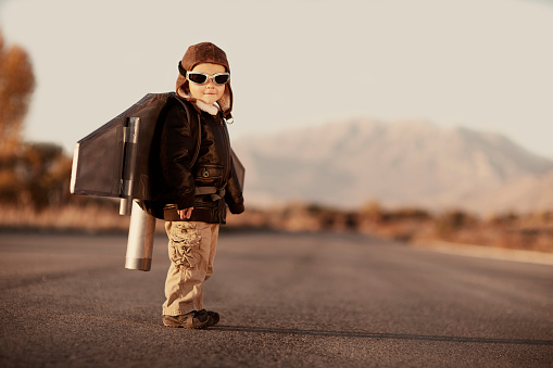 A young boy can't wait to fly the sky with his rocket pack.