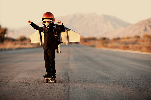 istock Young Boy Wearing Business Suit and Jet Pack 143920909