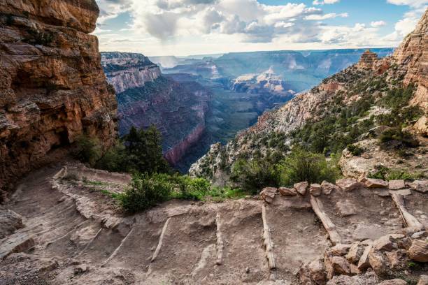 An evening view across Grand Canyon on South Kaibab Trail in Arizona desert of USA An evening view across Grand Canyon on South Kaibab Trail in Arizona desert of USA south kaibab trail stock pictures, royalty-free photos & images