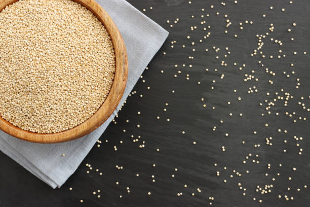istock Top view image of quinoa in wooden plate on table 1439211883
