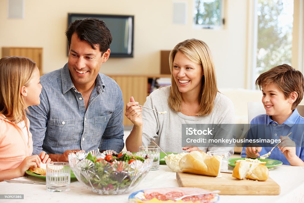 A family having dinner together  Family sharing meal at home Family Stock Photo