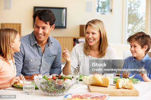 A Family Having Dinner Together Stock Photo - Download Image Now - Family, Dinner, Eating
