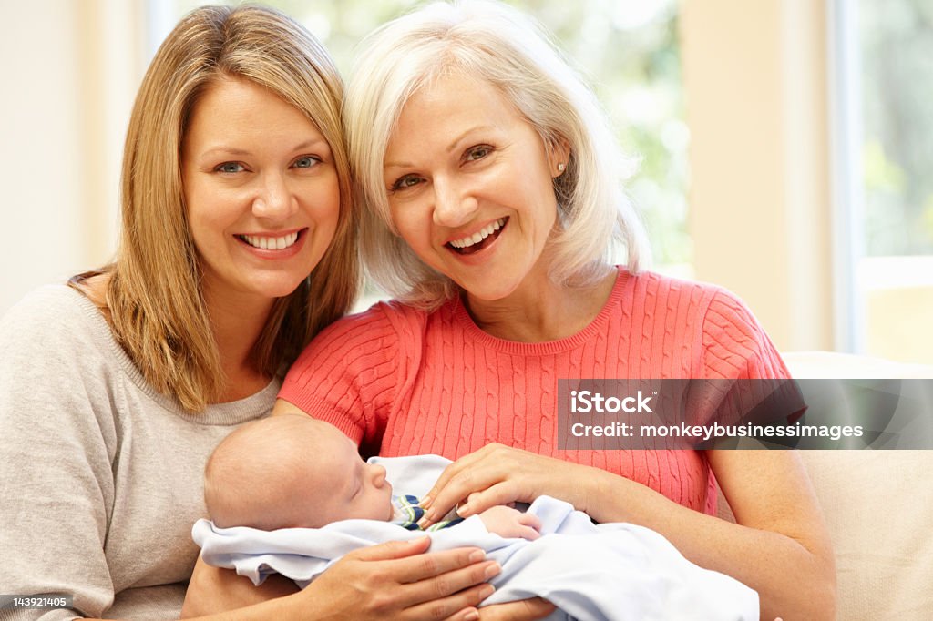 Multi-generation family portrait Multi-generation family portrait smiling at the camera Baby - Human Age Stock Photo