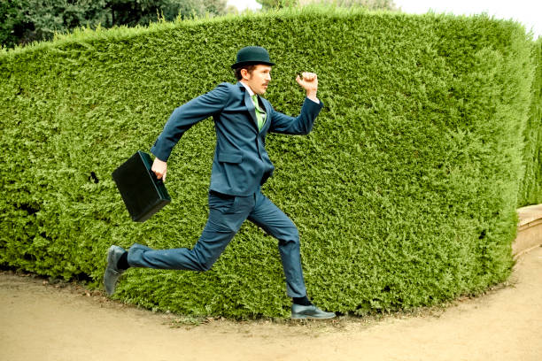 Rear view of businessman runninghttp://www.twodozendesign.info/i/1.png