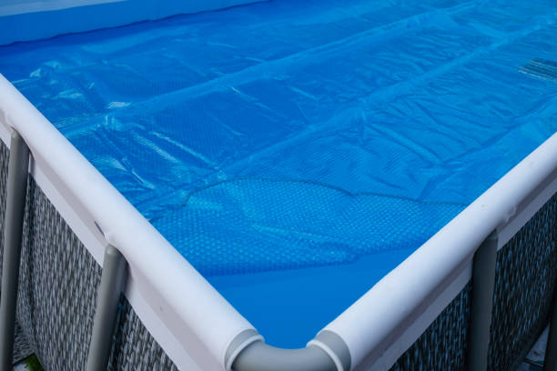 istock Pool cover. Blue solar film on the pool. 1439214442