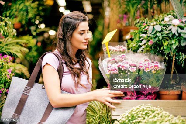 Young Women Buying Flowers At Market Stock Photo - Download Image Now - 20-24 Years, Adult, Adults Only
