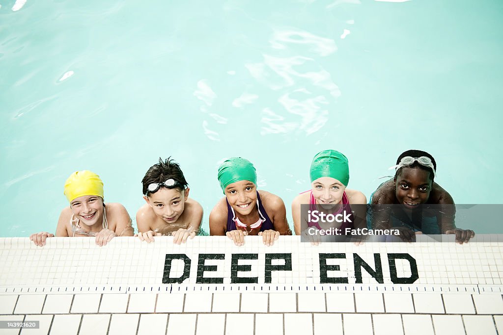 Kids swim team at the pool A children's swim team at the pool Elementary Age Stock Photo