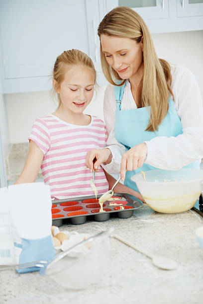 istock Little girl baking cake with mother 143921659