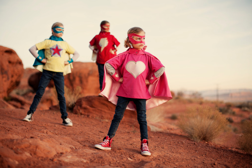 Three young child and sister superheroes stand up to the bullies of the world. It is never too early to be super. Just add type for the perfect concept. 