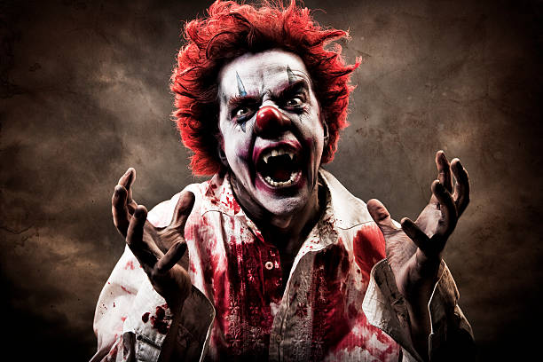 Evil Vampire Clown A stock photo of a creepy evil vampire clown. clown stock pictures, royalty-free photos & images