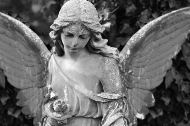 istock Abstract image with tragically sad American angel. Black and white concept. 1439220230