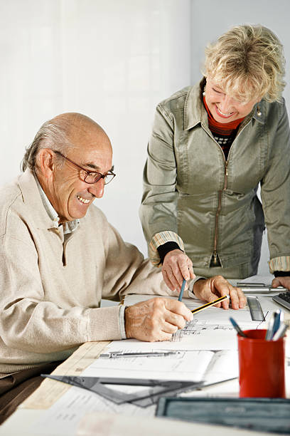 istock Mature Woman and Man Working at Desk 143922034