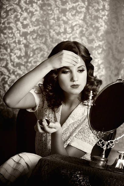 istock retro woman powdering face 143922066