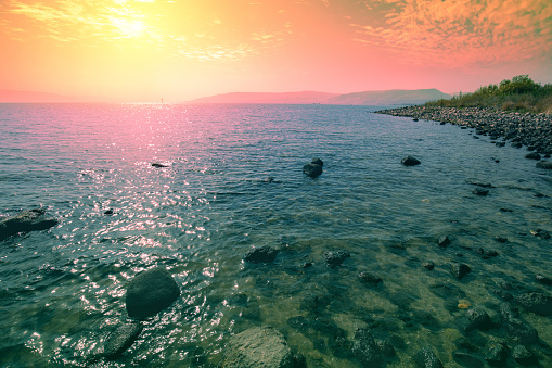 Rocky shore of the Sea of Galilee at sunrise