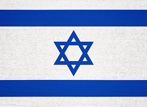 Israeli national flag on corrugated paper, ready for your grunge effects to be applied.