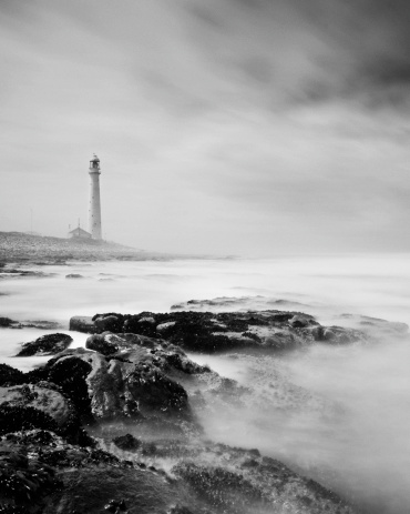 A long exposure seascape taken of Slangkop Lighthouse near Kommetjie, which is the tallest cast iron Lighthouse in South Africa.- View more of Cape Town in Black and White - 