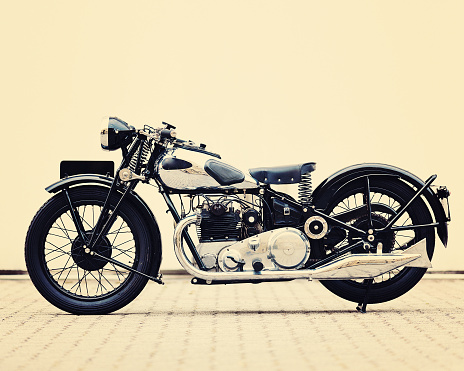 black and chrome vintage british motorcycle.