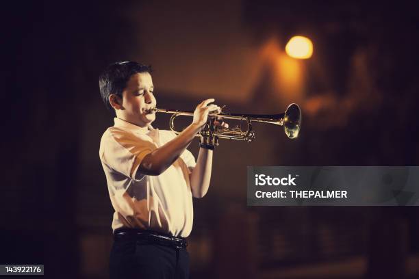 Eleven Years Old Kid Playing The Trumpet Stock Photo - Download Image Now - Child, Playing, Trumpet