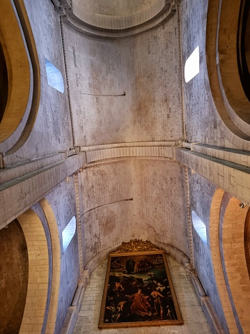 The Church of St. Trophime in Arles was built between the 12th century and the 15th century, and is in the Romanesque architectural tradition.  The image shows the ceiling of the main nave.