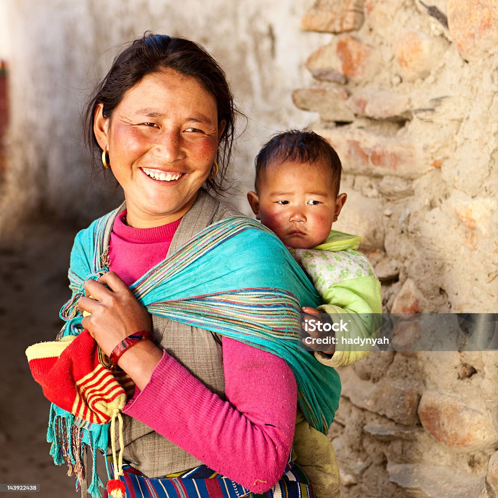 Tibetan woman carrying her baby  Mother Stock Photo