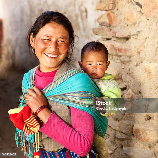 Tibetan Woman Carrying Her Baby Stock Photo - Download Image Now - Mother, Baby - Human Age, Nepal