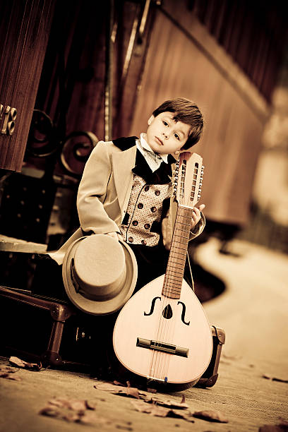 istock little boy in retro style as musician 143922569