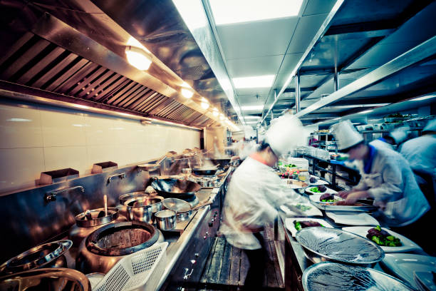 motion chefs  of a restaurant kitchen motion chefs  of a restaurant kitchen at china. chinese restaurant stock pictures, royalty-free photos & images