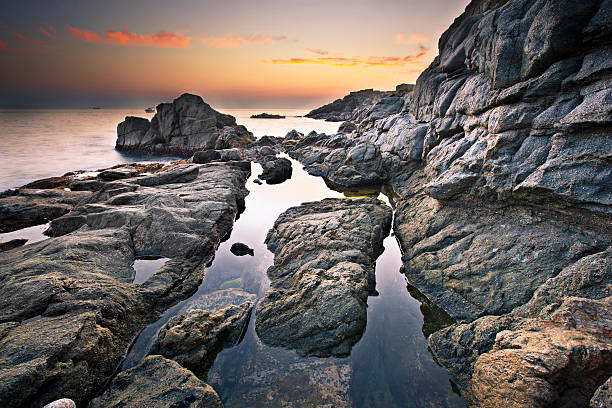 Dusk at the Mediterranean coast of Costa Brava - Added some grain.