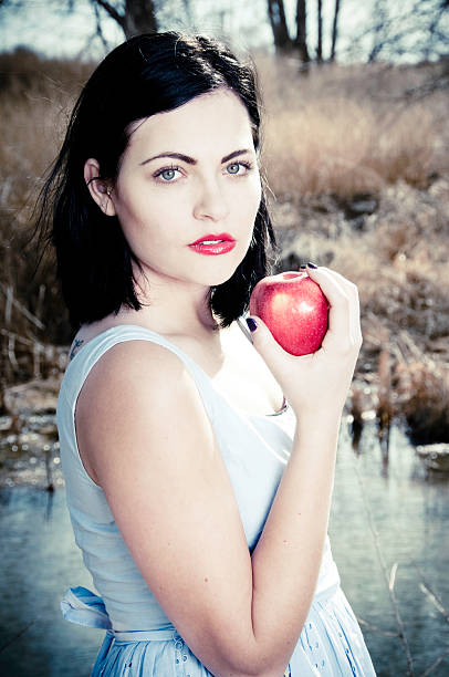 Girl with apple stock photo