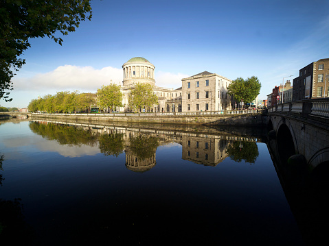 Four Courts complex Dublin Ireland reflected on the liffey river